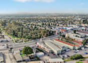 Thumbnail 43 of 51 - A cityscape with buildings, roads, and vehicles.