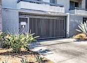 Thumbnail 34 of 54 - a garage door in front of an apartment building