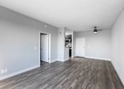 Thumbnail 40 of 54 - an empty living room with a hard wood floor and white walls