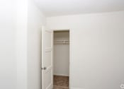 Thumbnail 35 of 47 - A white door is open to a small closet.