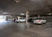 Thumbnail 20 of 20 - a parking garage with cars parked in it