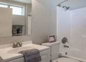 Thumbnail 11 of 20 - a white bathroom with a toilet and a sink