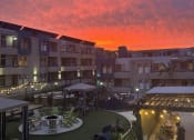 Thumbnail 54 of 54 - a view of the sunset over an apartment complex with a courtyard