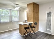 Thumbnail 8 of 31 - a kitchen with a island and two chairs
