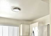 Thumbnail 12 of 21 - a kitchen with stainless steel appliances and white cabinets