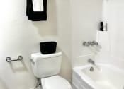 Thumbnail 12 of 31 - a bathroom with a toilet and a tub and a sink