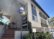 Thumbnail 9 of 30 - A building with a sign that says