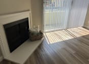 Thumbnail 35 of 45 - a living room with a fireplace and a sliding glass door