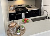 Thumbnail 40 of 45 - a kitchen with black cabinets and stainless steel appliances