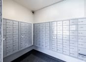 Thumbnail 29 of 37 - A wall of mailboxes numbered from 107 to 250.