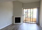 Thumbnail 13 of 37 - Spacious Living Room Flooring Throughout Fireplace & Balcony