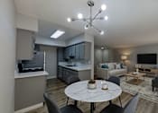 Thumbnail 1 of 34 - A modern living room with a dining table and grey chairs.