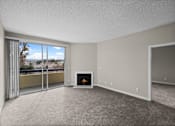 Thumbnail 1 of 45 - a living room with a fireplace and a balcony