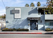 Thumbnail 39 of 40 - A building with a sign that says "Villa Park Apartments".