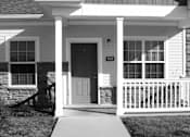 Thumbnail 6 of 23 - A black and white image of a house with the number 905 on the front door.