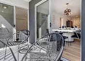 Thumbnail 17 of 18 - a patio with two chairs and a table at 8535 Colgate-Fully Furnished Apartments, Los Angeles, 90048