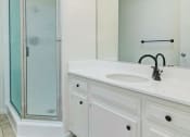 Thumbnail 7 of 12 - White counter top, new vanity faucet, lighting, and shower enclosure
