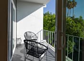 Thumbnail 18 of 18 - a view of the balcony from the door of a hotel room at 8535 Colgate-Fully Furnished Apartments, California, 90048