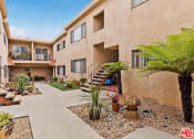 Thumbnail 4 of 12 - Center courtyard entry access to all apartment homes