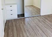 Thumbnail 13 of 21 - an empty bedroom with a mirror and a closet