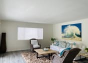 Thumbnail 3 of 12 - Open living room fits center table, end table, sofa, and two accent chairs with area rug