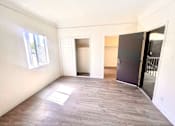 Thumbnail 15 of 23 - Living space with closet and window