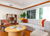 Thumbnail 12 of 18 - a living room with a couch and a table at 8535 Colgate-Fully Furnished Apartments, California