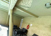 Thumbnail 20 of 21 - A patio with black chairs and a red life preserver on the wall.