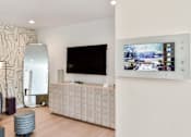 Thumbnail 3 of 18 - a living room with a television on the wall at 8535 Colgate-Fully Furnished Apartments, California, 90048