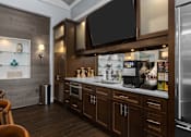 Thumbnail 16 of 18 - A modern kitchen with dark wood cabinets and stainless steel appliances. at Merion at Cross Keys Apartments, Apartments, Williamstown, NJ