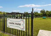 Thumbnail 9 of 21 - A sign that says Bark Park is on a black fence.