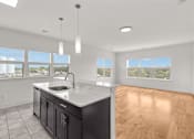 Thumbnail 14 of 15 - A kitchen with a sink and a window.