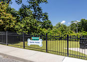 Thumbnail 4 of 19 - A sign that says Bark Park is on a black fence.