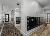 Thumbnail 23 of 23 - A hallway with a carpeted floor and a wall of lockers on the right side.