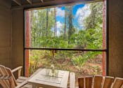 Thumbnail 27 of 34 - a room with a table and chairs and a large window at Timberwalk at Mandarin Apartment Homes, Florida, 32257