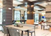 Thumbnail 18 of 20 - A modern dining room with a large table and chairs.