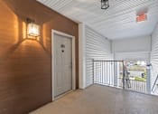 Thumbnail 6 of 16 - A white door is open to a balcony with a metal railing. at Pennsauken Golf Course Villas, PENNSAUKEN, NJ, 08109