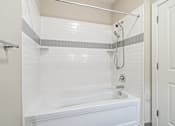 Thumbnail 13 of 16 - A white bathroom with a white tub and a white shower. at Pennsauken Golf Course Villas, PENNSAUKEN