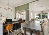 Thumbnail 13 of 34 - a dining room and living room with a table and chairs at Timberwalk at Mandarin Apartment Homes, Florida, 32257