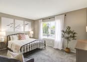 Thumbnail 15 of 32 - Bedroom with cozy bed at The Fountains at Deerwood Apartments, Jacksonville, FL, 32256