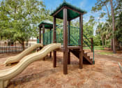 Thumbnail 32 of 34 - children's playground with slides at Timberwalk at Mandarin Apartment Homes, Florida, 32257
