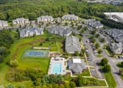 Thumbnail 35 of 35 - an aerial view of a neighborhood with houses and a swimming pool at The Austin Apartment Homes, Deptford, New Jersey