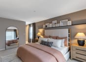 Thumbnail 13 of 35 - a bedroom with a bed and a mirror at The Austin Apartment Homes, New Jersey, 08096