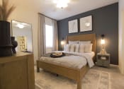 Thumbnail 22 of 36 - a bedroom with a bed and a dresser and a window  at Carillon Woods, Delaware
