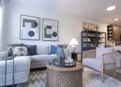Thumbnail 18 of 36 - a living room with couches and chairs and a table  at Carillon Woods, Delaware