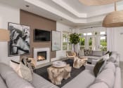 Thumbnail 1 of 20 - Clubroom With TV and Fireplace at Champions Walk Apartment Homes, Florida, 34210
