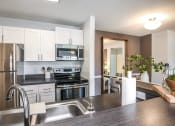 Thumbnail 6 of 20 - Fully Equipped Kitchen at Champions Walk Apartment Homes, Bradenton, Florida