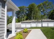 Thumbnail 6 of 27 - a house with a driveway and a white fenceat Merion Stratford Apartment Homes, Stratford, CT