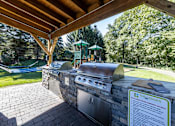 Thumbnail 26 of 28 - A grill area with a sign that says The Edges.