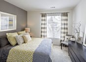 Thumbnail 8 of 27 - a bedroom with a bed and a window at Merion Stratford Apartment Homes, Stratford, CT